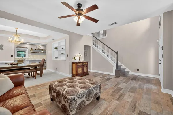 a bathroom with a tub sink shower and mirror