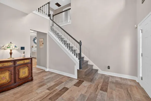 a bathroom with a tub a sink and a shower