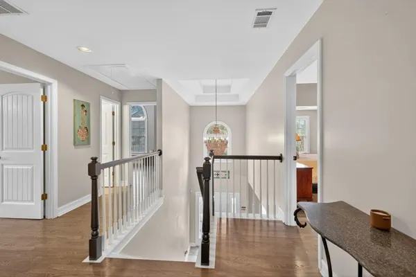 a large white kitchen with a large window