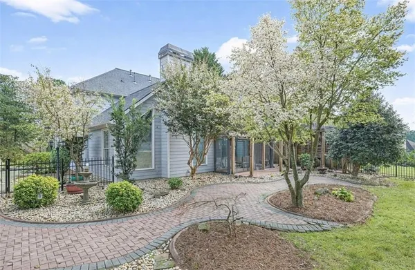 a front view of a house with garden