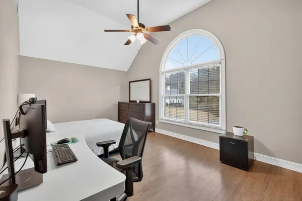 a front view of a house with a yard and a garage