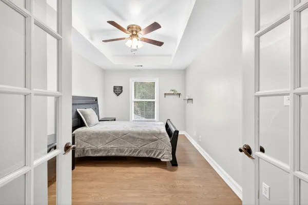 a living room with furniture and a floor to ceiling window