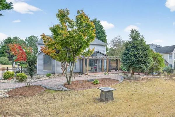 an aerial view of a house with a garden