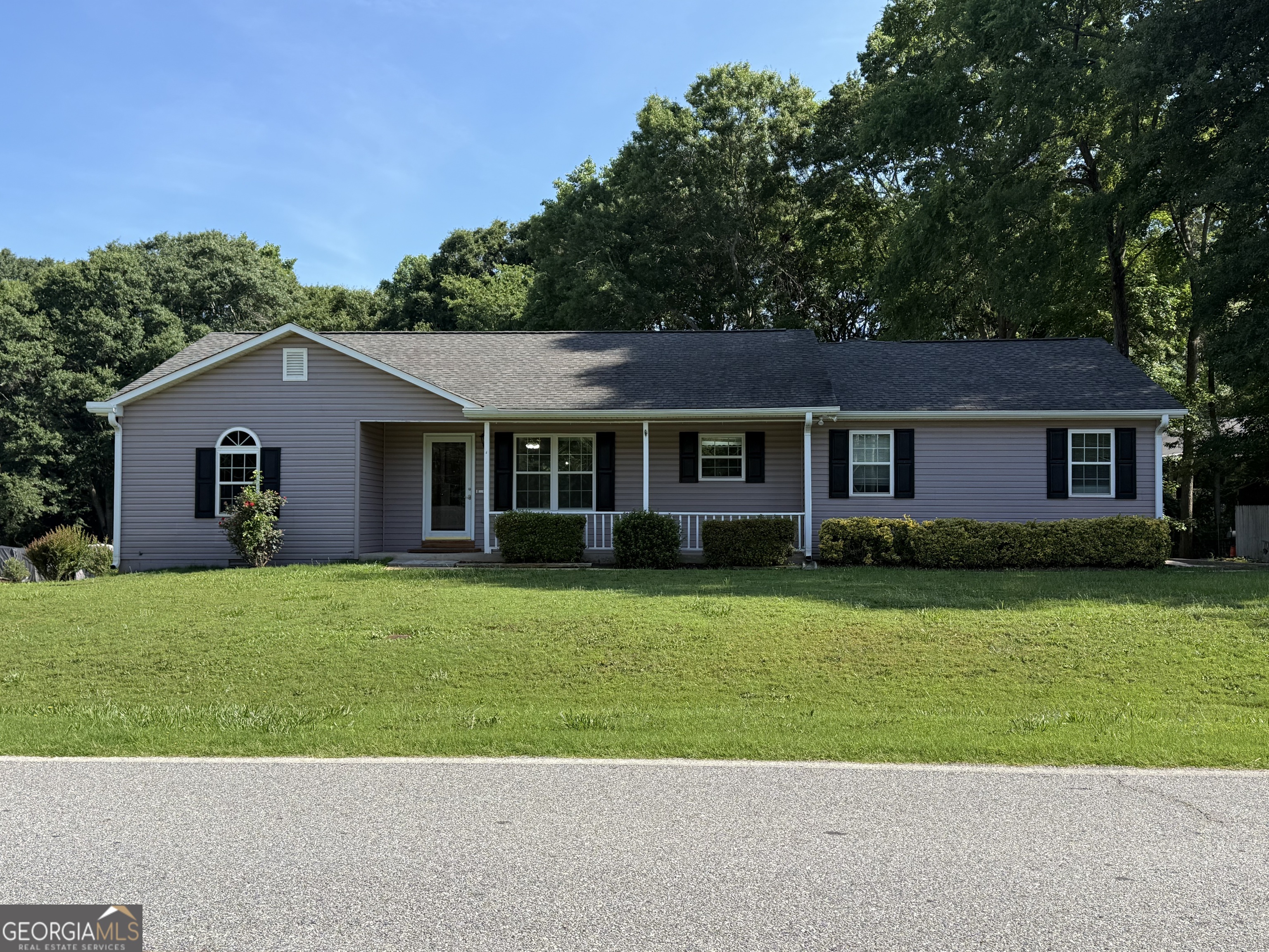 384 Sam Brown Boulevard Commerce, GA 30529 - Photo 2 of 25 a front view of a house with a garden