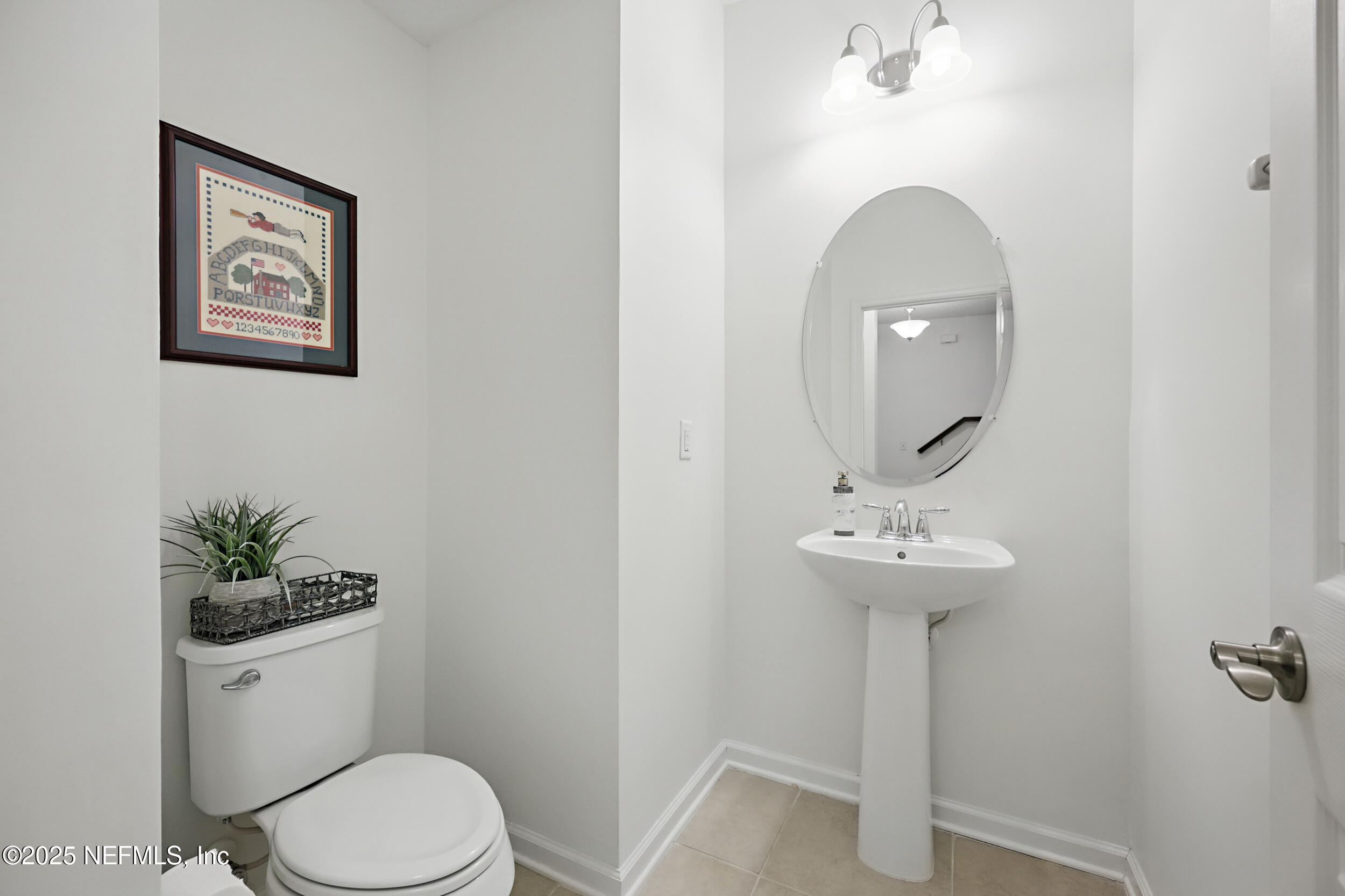 63 Via Sonrisa St. Augustine, FL 32092 - Photo 21 of 48 a bathroom with a toilet sink and mirror