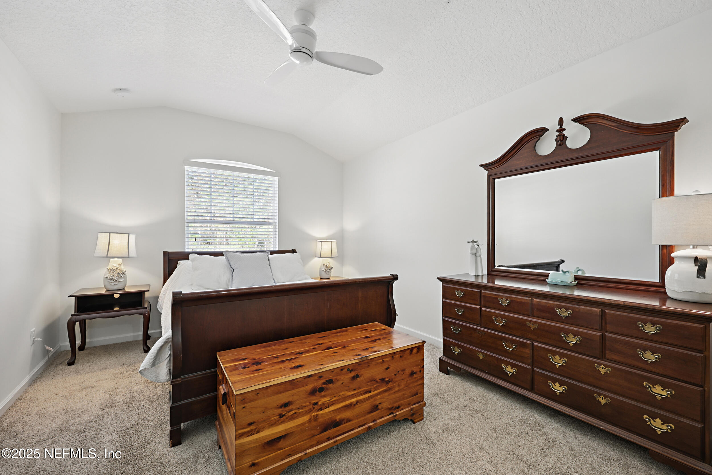 63 Via Sonrisa St. Augustine, FL 32092 - Photo 25 of 48 a room with a dresser and a mirror
