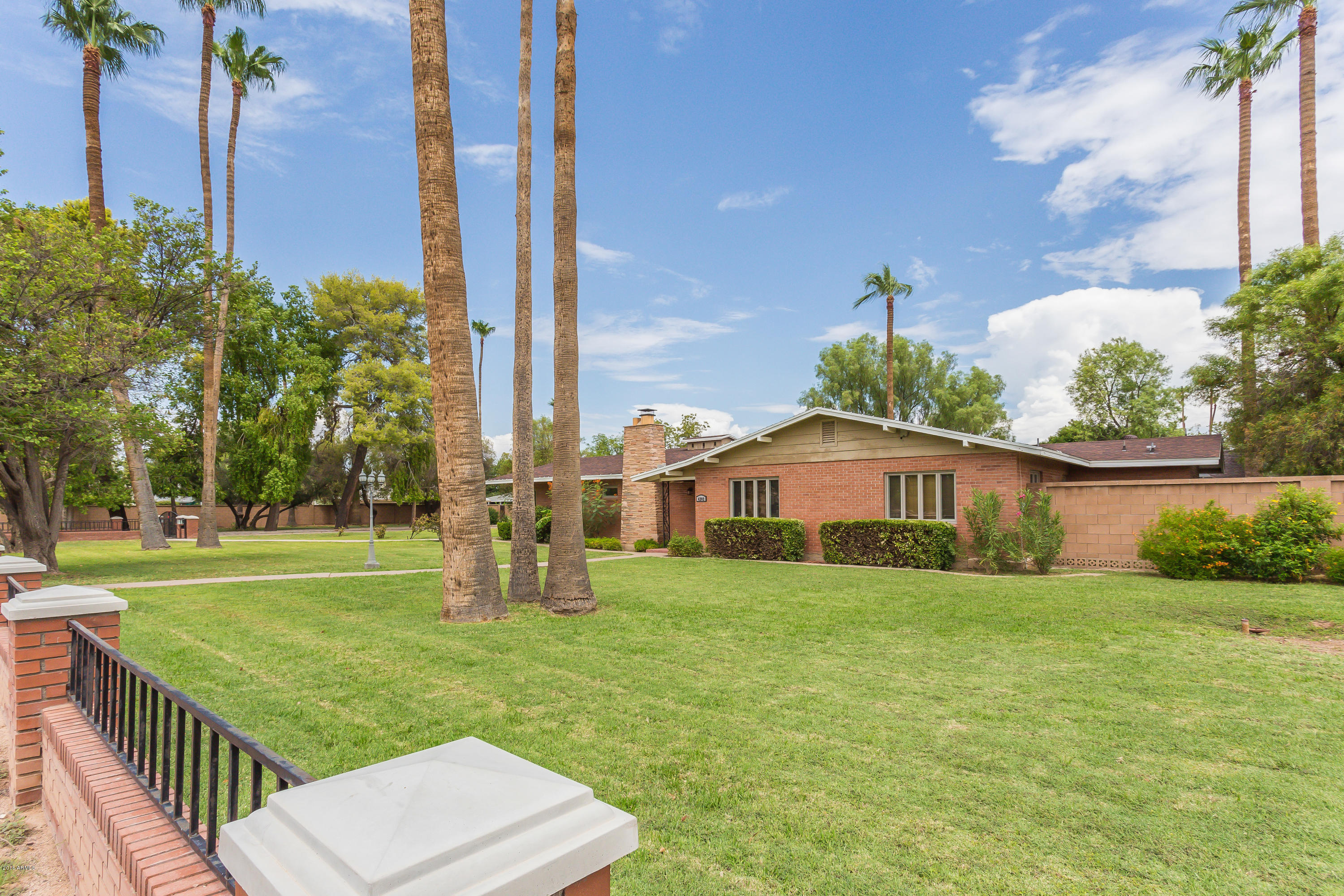 4202 East Osborn Road Phoenix, AZ 85018 - Photo 3 of 34 Lush Grass and Mature Trees