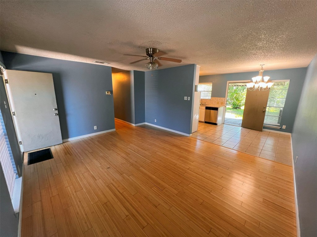 a view of a livingroom with wooden floor
