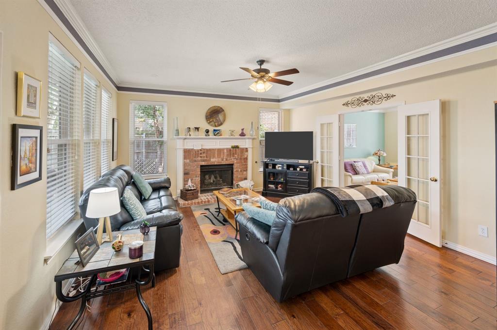 2156 Sandell Drive Grapevine, TX 76051 - Photo 11 of 40 a living room with furniture and a fireplace