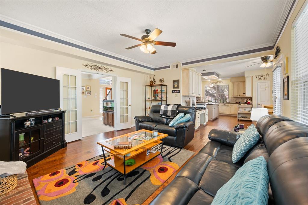 2156 Sandell Drive Grapevine, TX 76051 - Photo 12 of 40 a living room with furniture and a flat screen tv