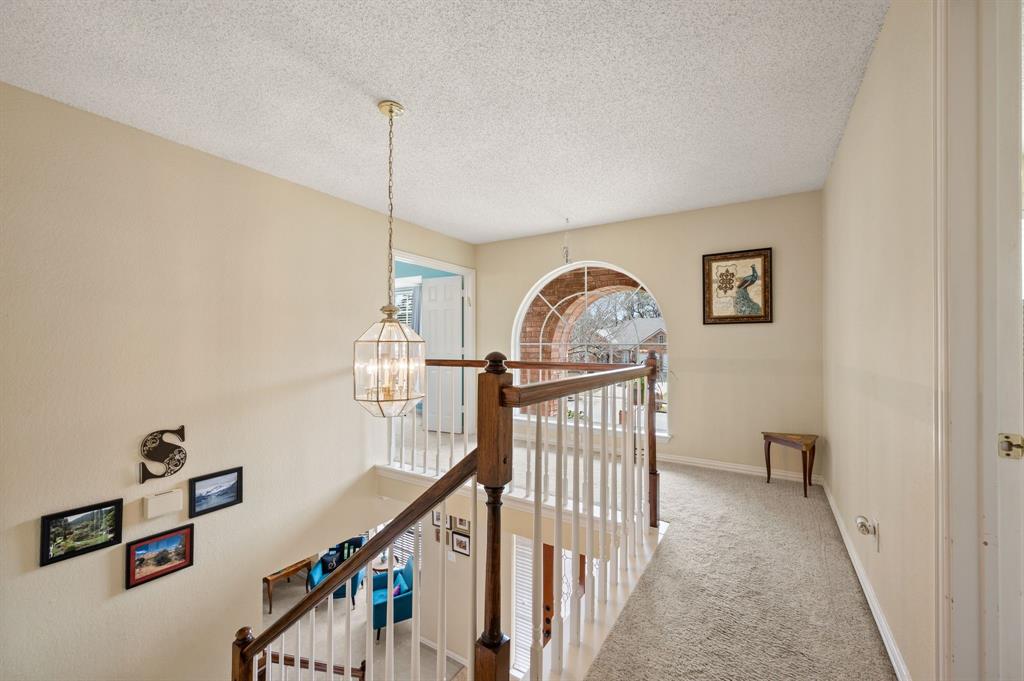 2156 Sandell Drive Grapevine, TX 76051 - Photo 22 of 40 a view of a hallway with workspace