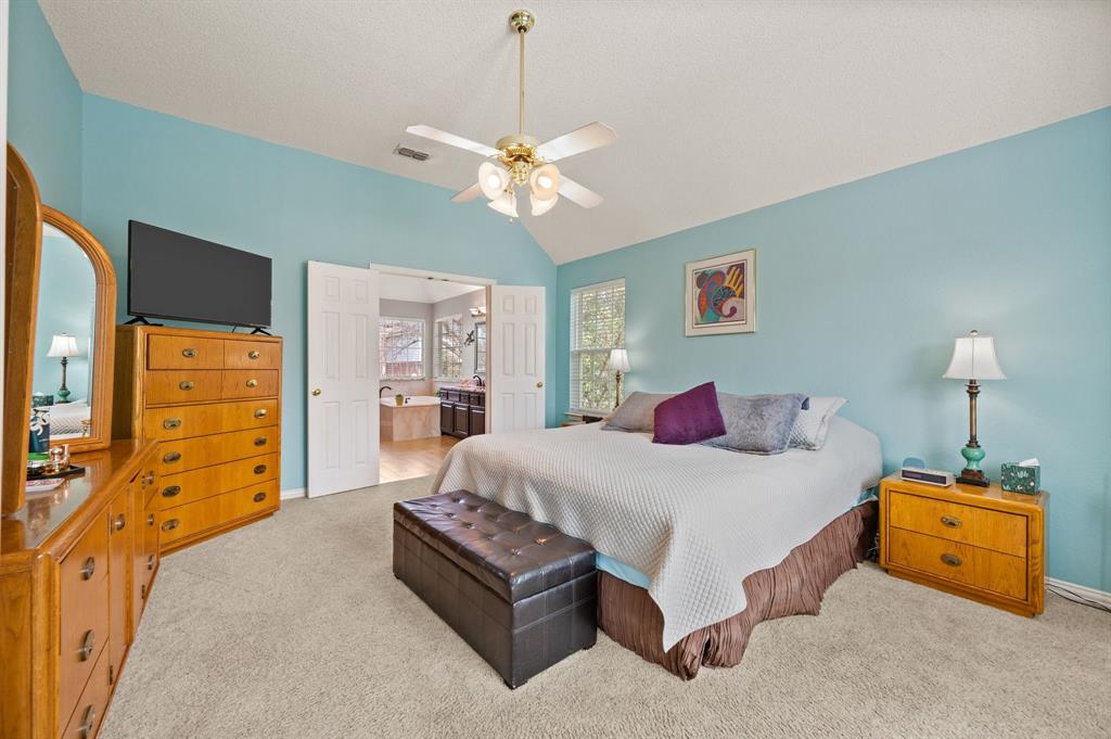 2156 Sandell Drive Grapevine, TX 76051 - Photo 23 of 40 a bedroom with a bed and dresser