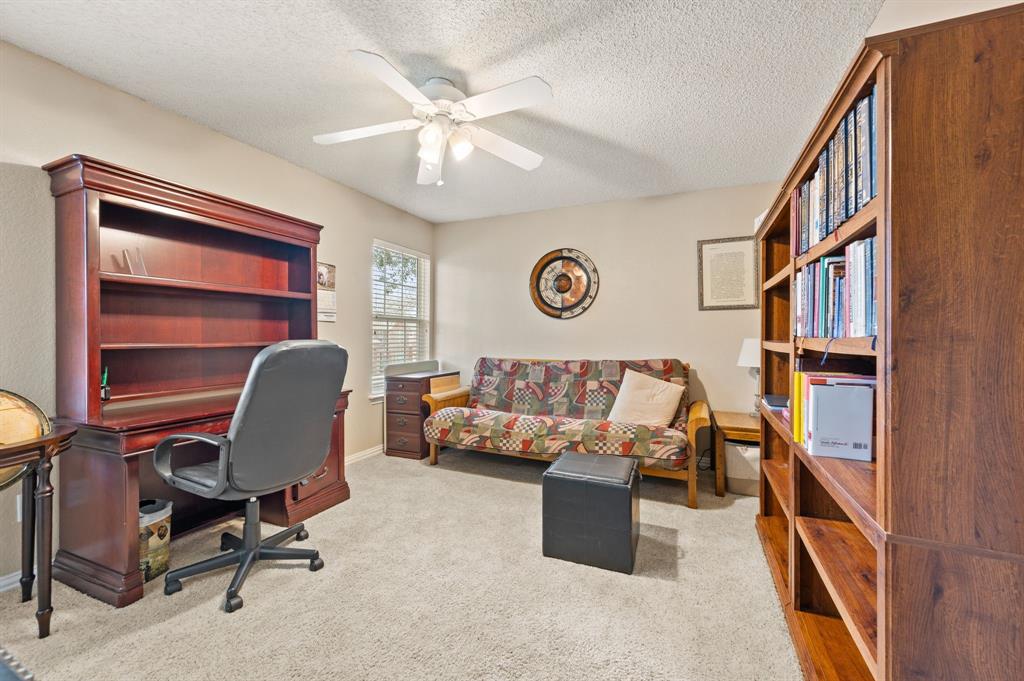 2156 Sandell Drive Grapevine, TX 76051 - Photo 30 of 40 a reading room with furniture and book shelfs