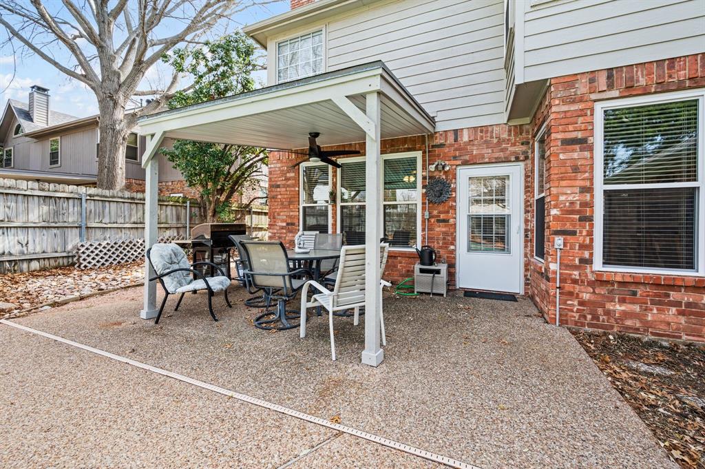 2156 Sandell Drive Grapevine, TX 76051 - Photo 33 of 40 a view of a patio with table and chairs and potted plants
