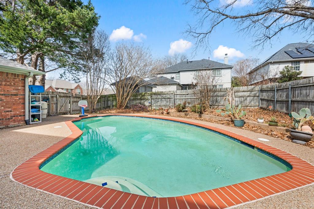 2156 Sandell Drive Grapevine, TX 76051 - Photo 34 of 40 a view of a swimming pool with a patio