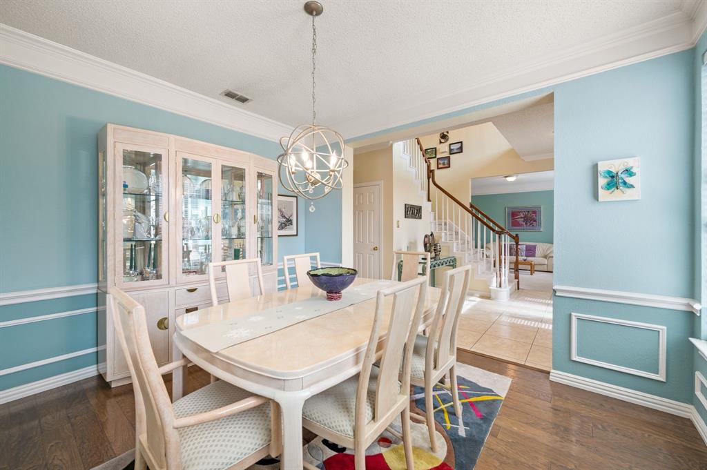 2156 Sandell Drive Grapevine, TX 76051 - Photo 6 of 40 a view of a dining room with furniture wooden floor and chandelier