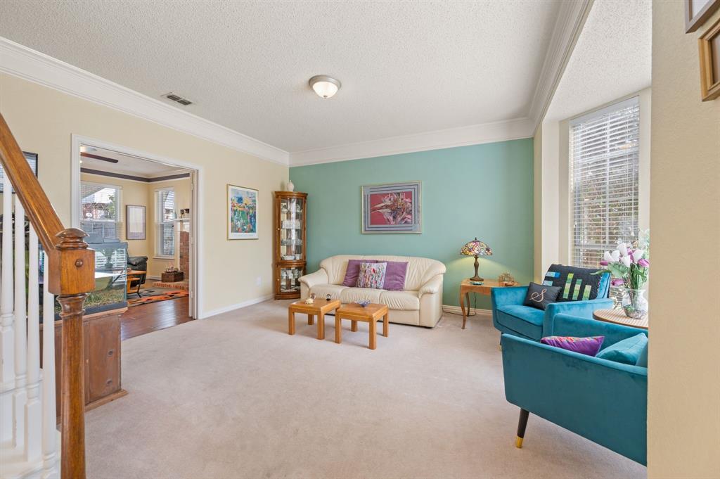 2156 Sandell Drive Grapevine, TX 76051 - Photo 8 of 40 a living room with furniture and a flat screen tv