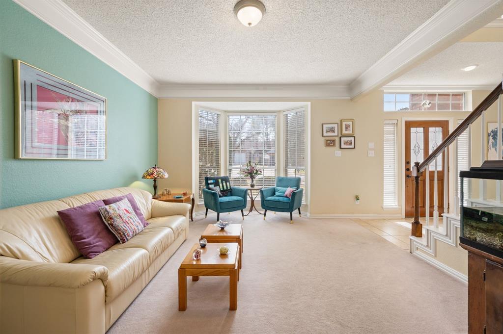2156 Sandell Drive Grapevine, TX 76051 - Photo 9 of 40 a living room with furniture and a flat screen tv