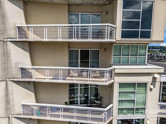 a kitchen with refrigerator a microwave and cabinets