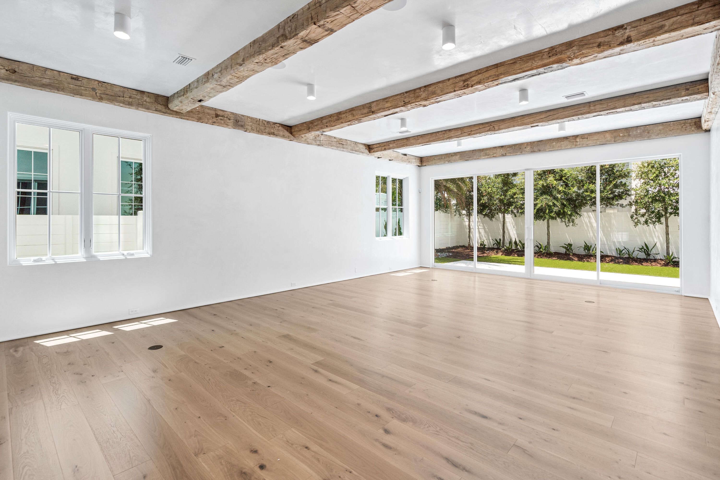 74 Elysee Ct Inlet Beach Inlet Beach, FL 32461 - Photo 11 of 46 a view of empty room with wooden floor and fan