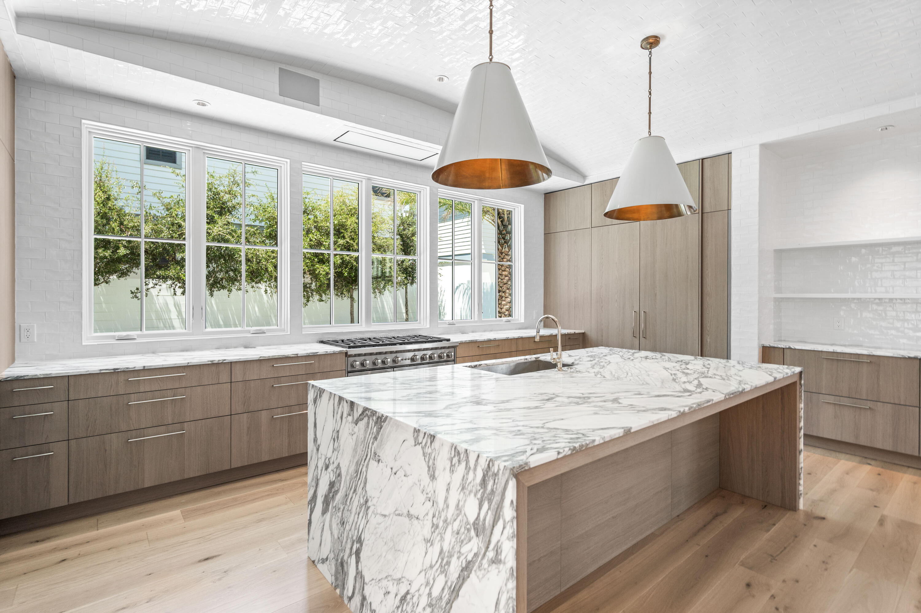 74 Elysee Ct Inlet Beach Inlet Beach, FL 32461 - Photo 14 of 46 a kitchen with stainless steel appliances granite countertop a sink a stove and a wooden floors