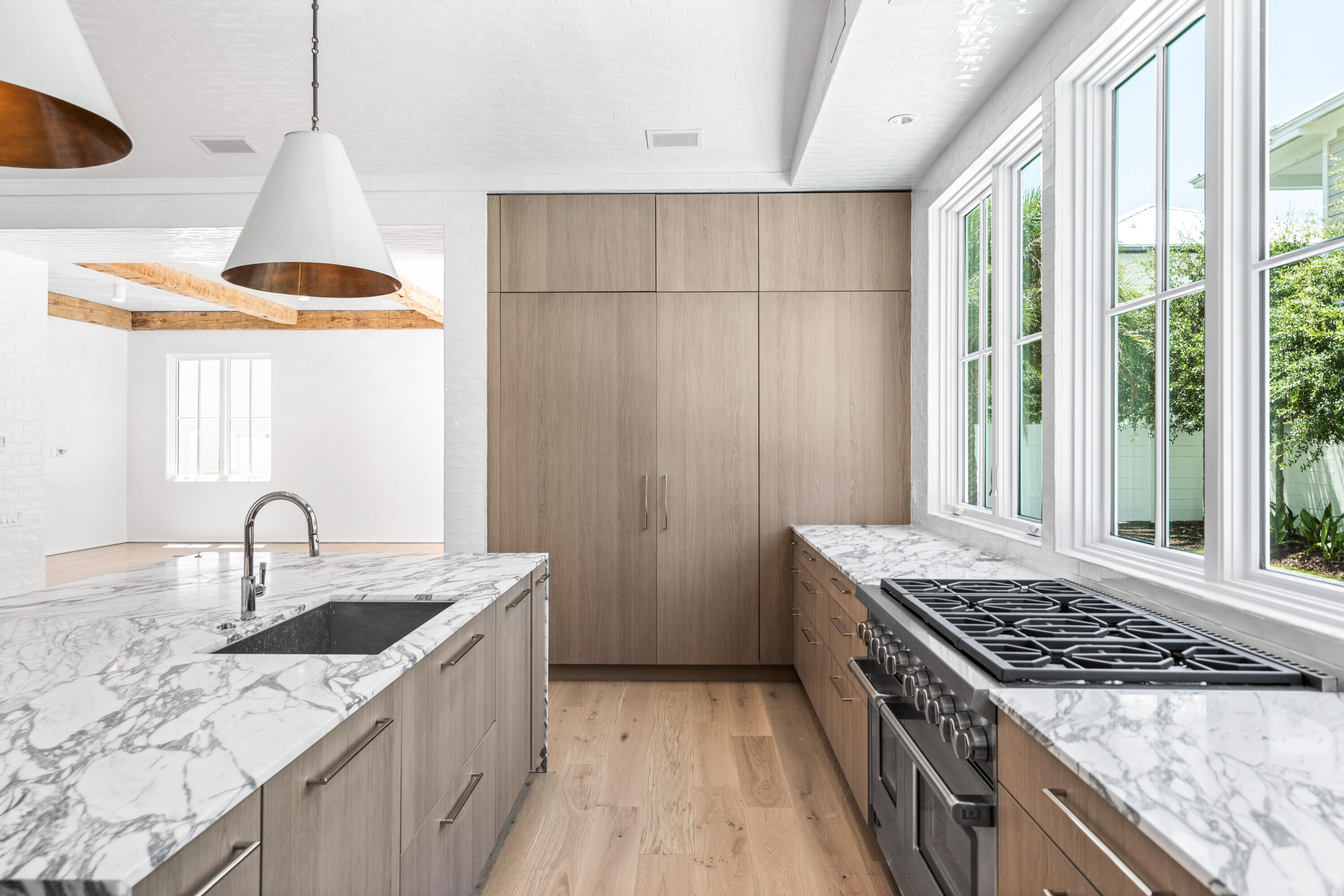 74 Elysee Ct Inlet Beach Inlet Beach, FL 32461 - Photo 17 of 46 a kitchen with a sink stove and cabinets