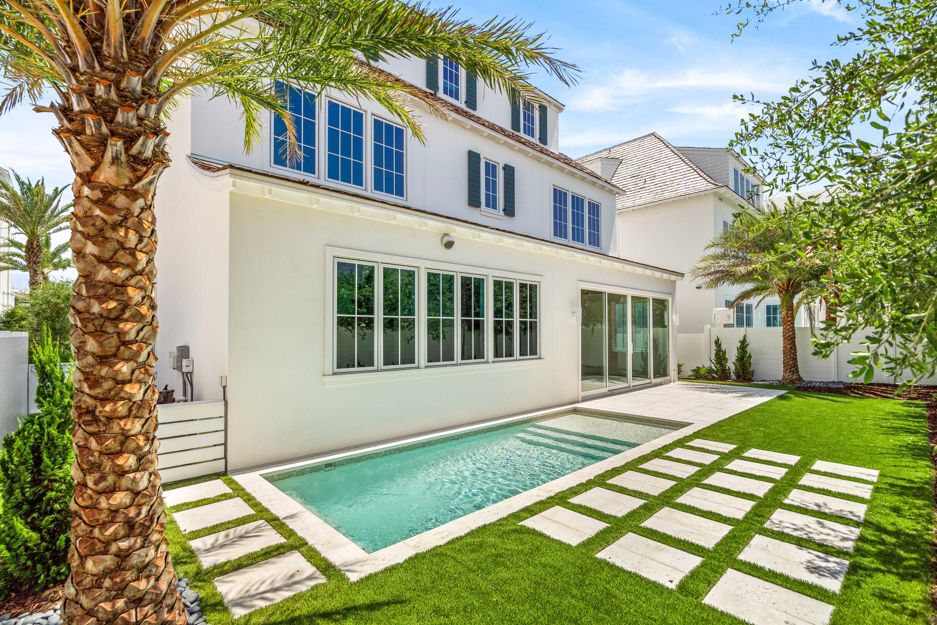 74 Elysee Ct Inlet Beach Inlet Beach, FL 32461 - Photo 2 of 46 a front view of a house with a yard