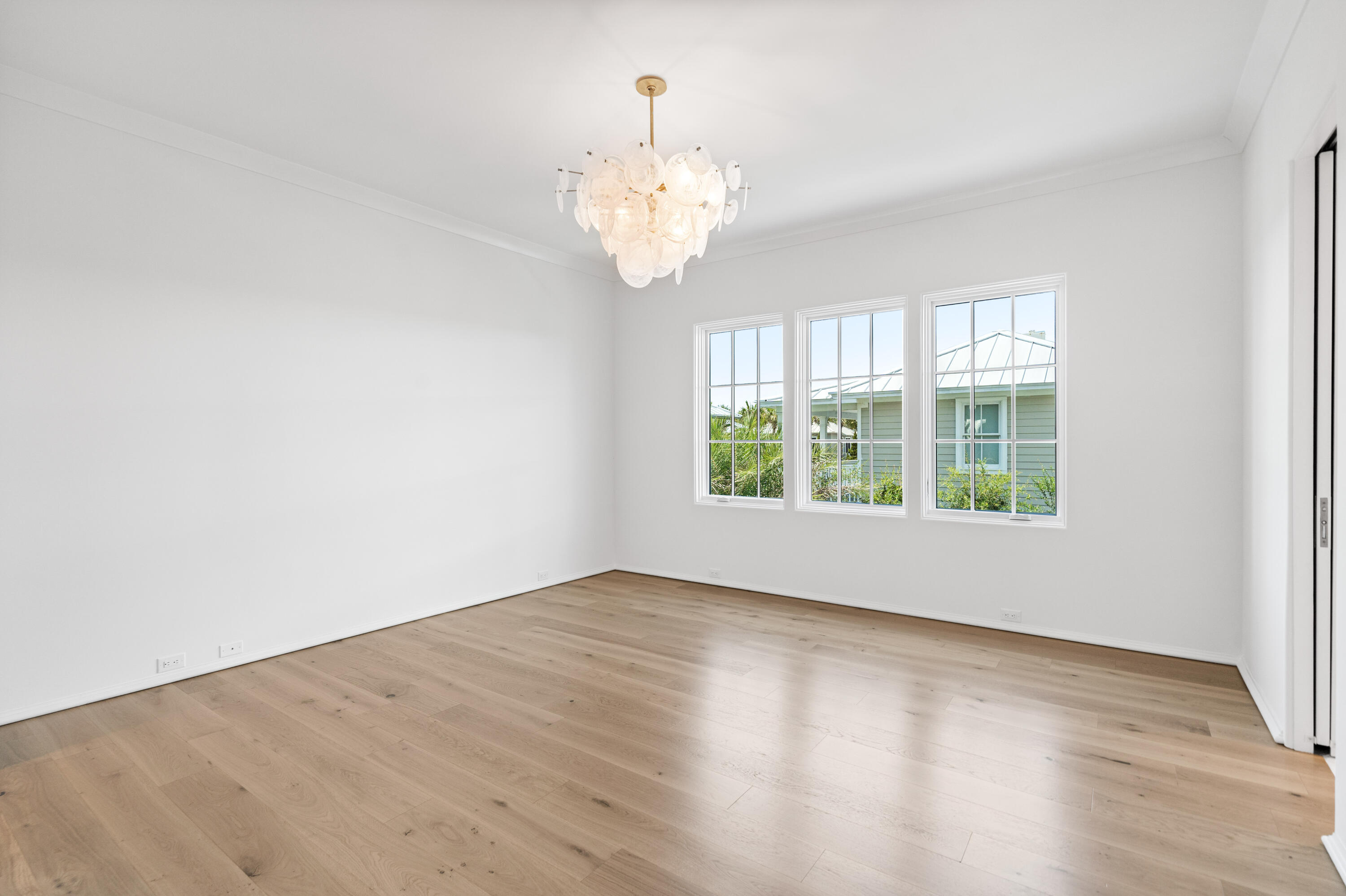 74 Elysee Ct Inlet Beach Inlet Beach, FL 32461 - Photo 23 of 46 a view of an empty room with wooden floor and a window