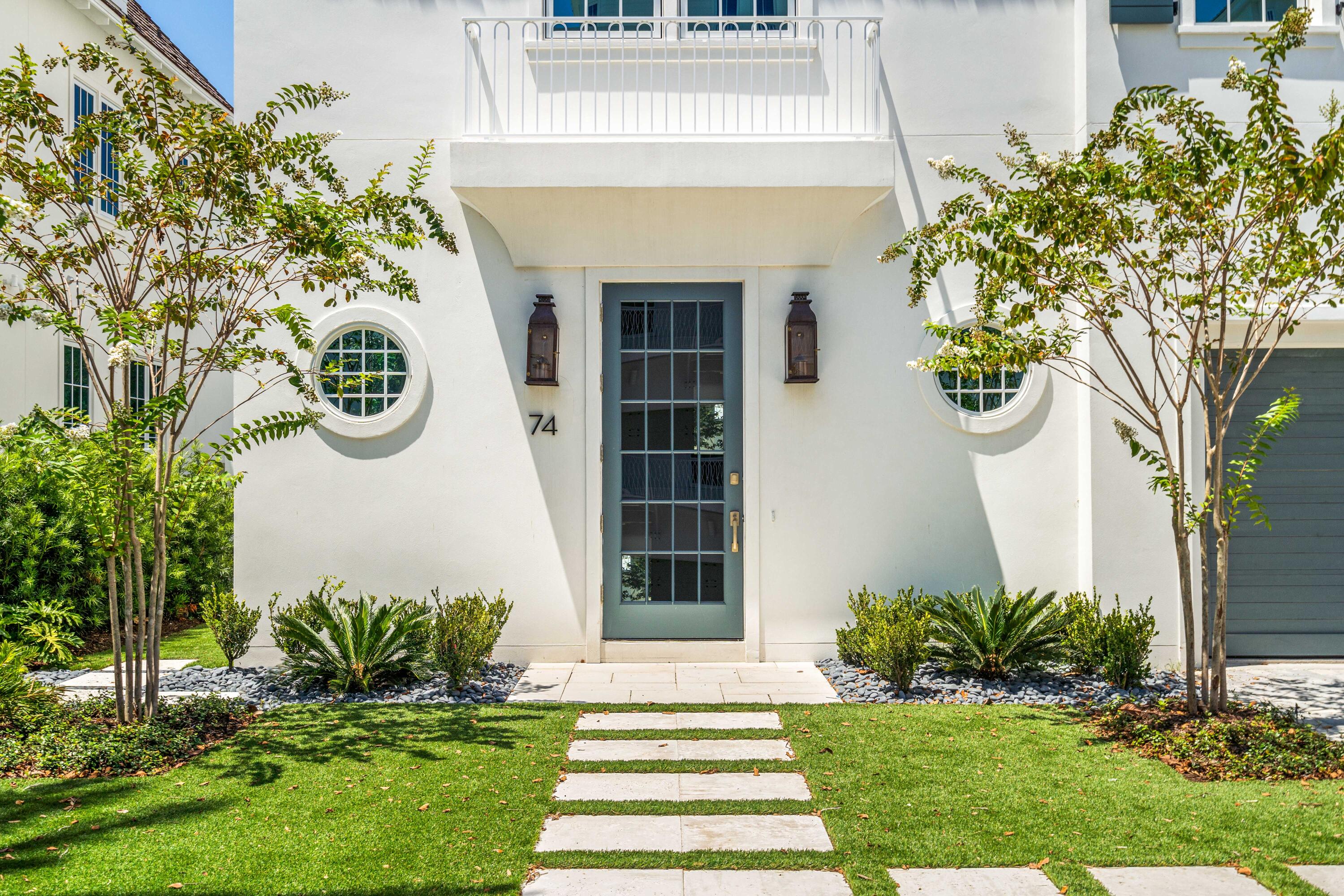 74 Elysee Ct Inlet Beach Inlet Beach, FL 32461 - Photo 5 of 46 a front view of a house with a garden