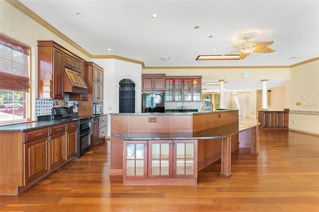 a view of an entryway with wooden floor
