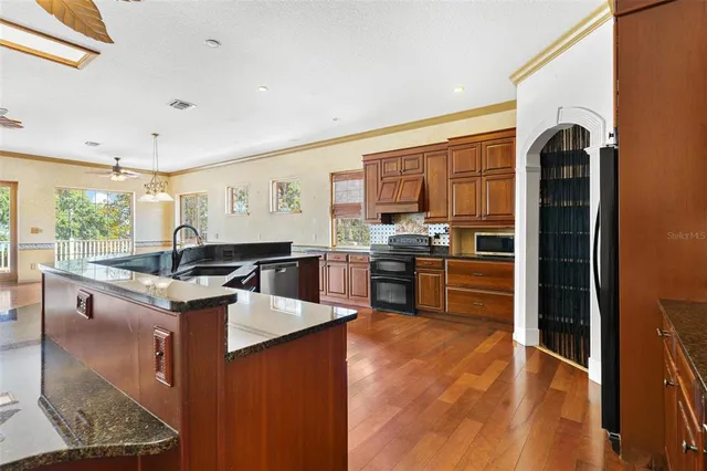 a bedroom with a bed couch and window