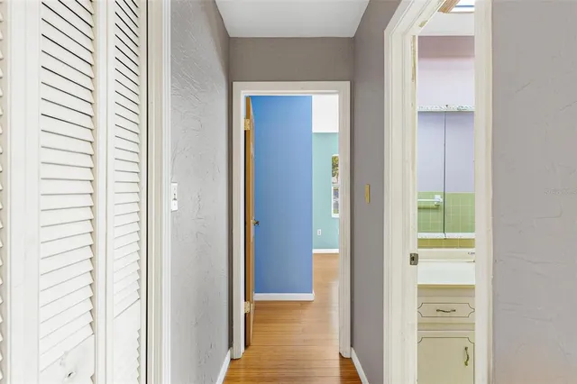 a bathroom with a granite countertop sink a toilet and bathtub
