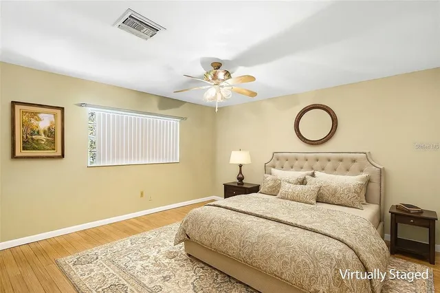 a large house with a big yard and large trees