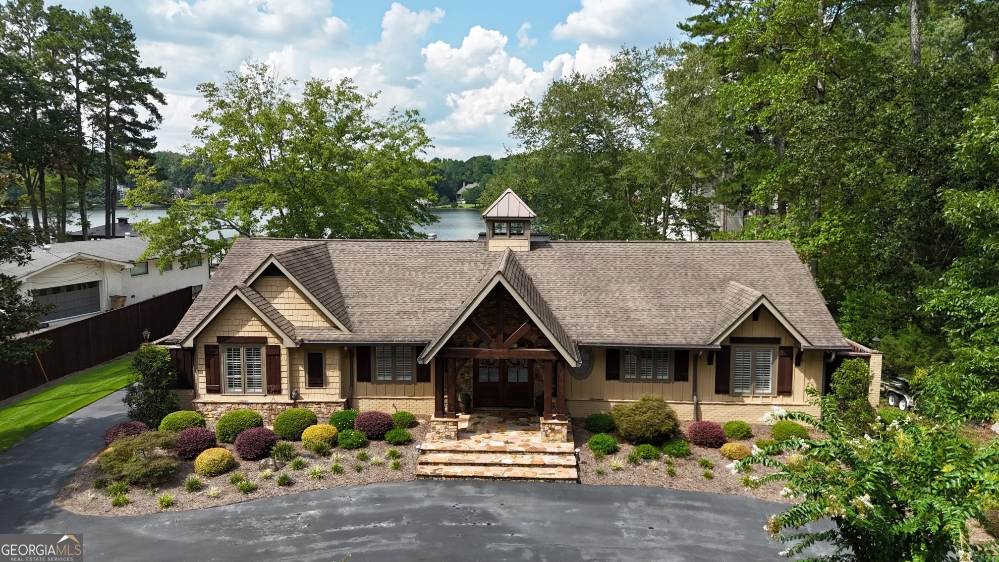2484 Emerald Drive Jonesboro, GA 30236 - Photo 4 of 55 a view of house with garden and tall trees