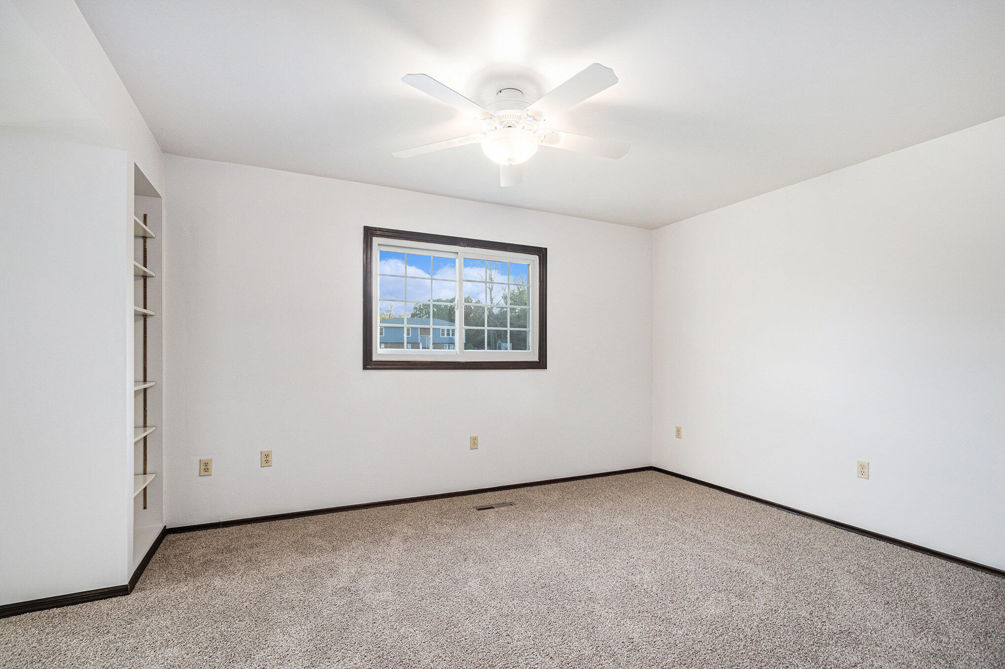 71 Tanglewood Trail Valparaiso, IN 46385 - Photo 14 of 46 an empty room with a ceiling fan and a window