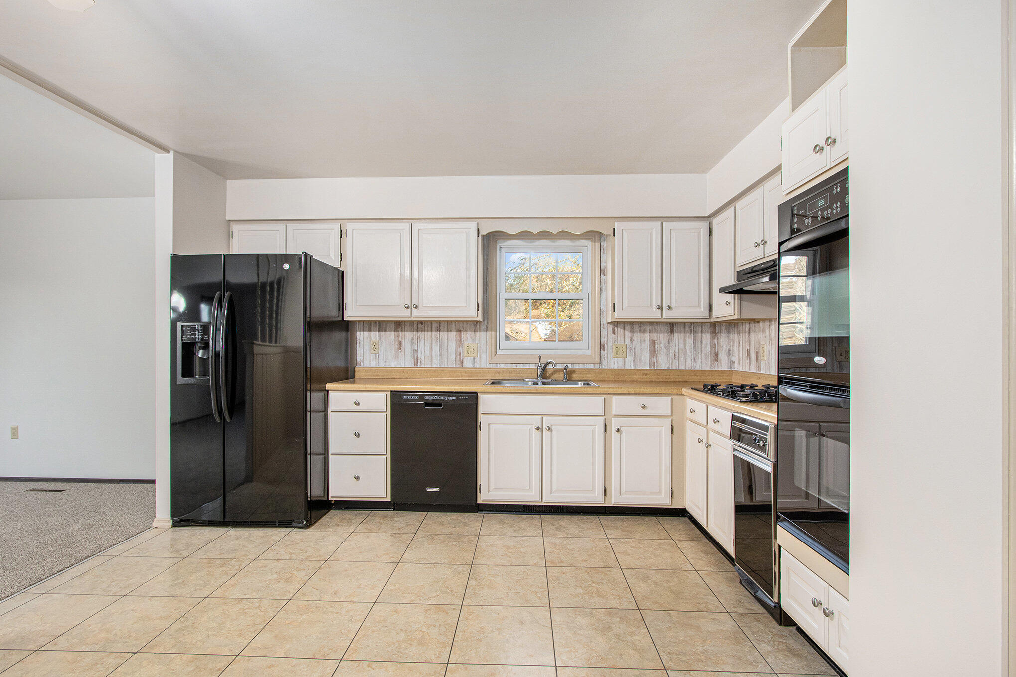 71 Tanglewood Trail Valparaiso, IN 46385 - Photo 10 of 46 a kitchen with stainless steel appliances granite countertop a refrigerator and a stove top oven