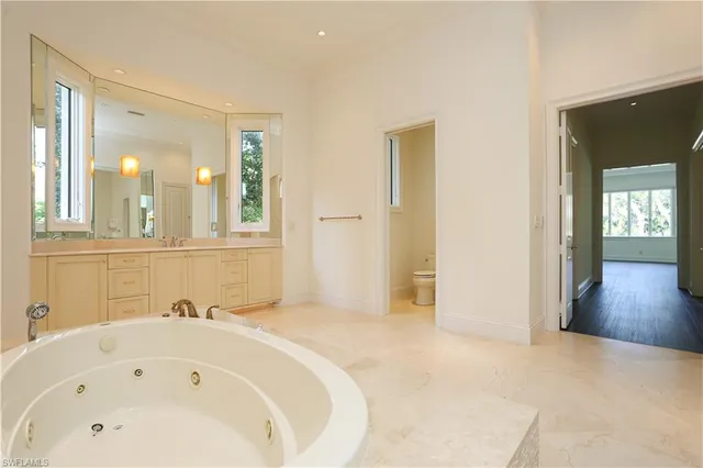 a bathroom with a bathtub and a sink