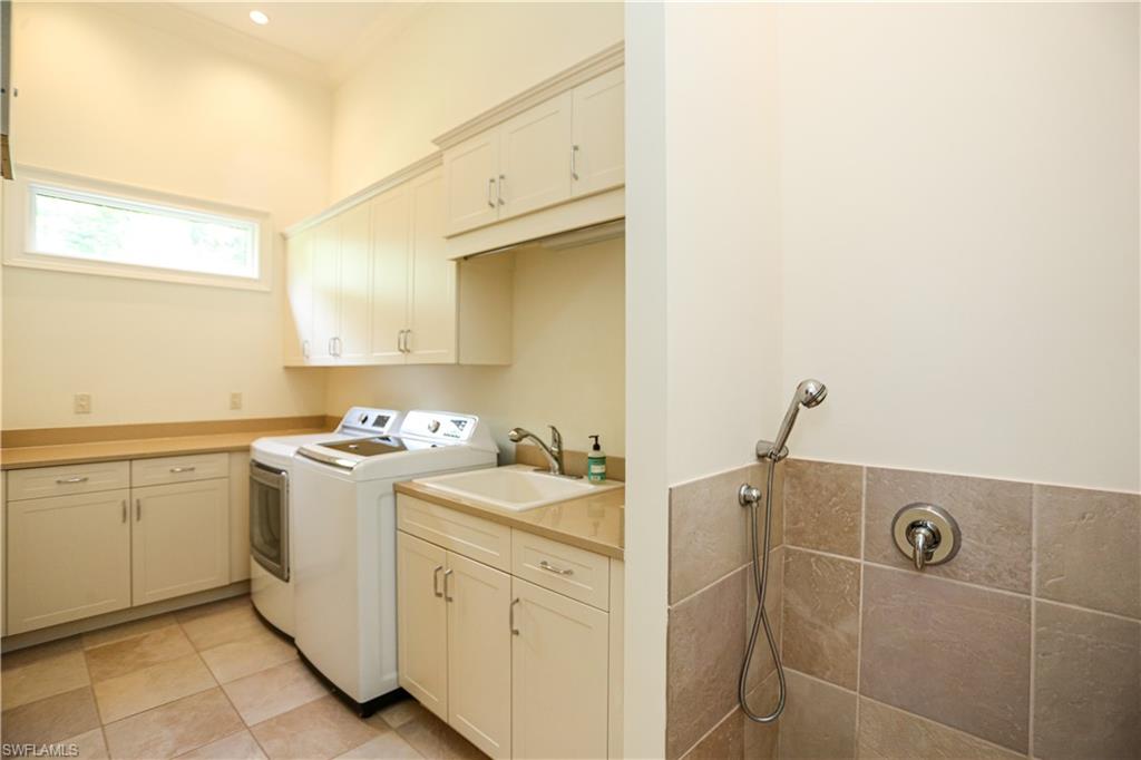 823 Cassena Road Naples, FL 34108 - Photo 31 of 50 a utility room with dryer and washer