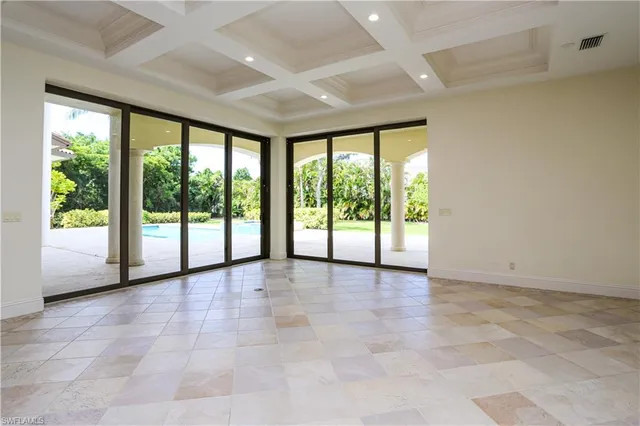 a view of an empty room with a large window