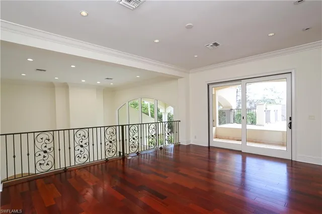a view of an entryway with wooden floor