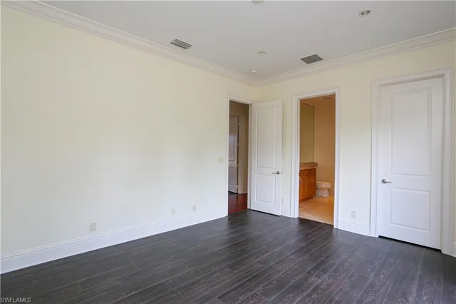 a view of an empty room and wooden floor