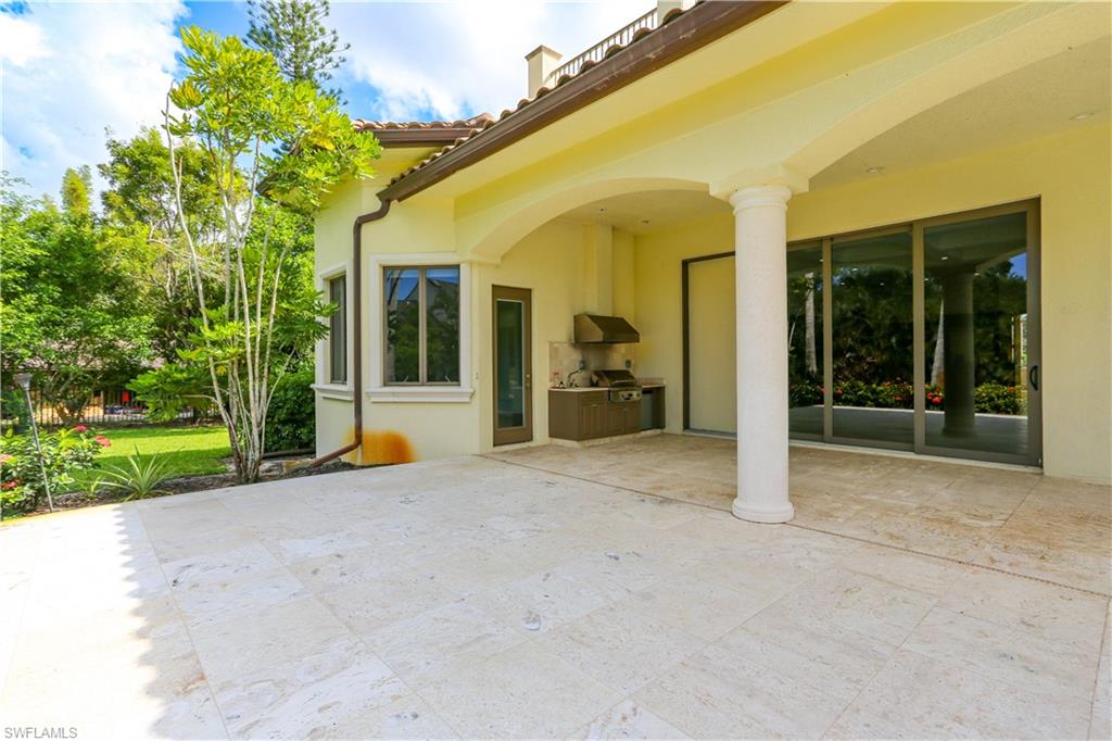 823 Cassena Road Naples, FL 34108 - Photo 8 of 50 front view of a house with a porch