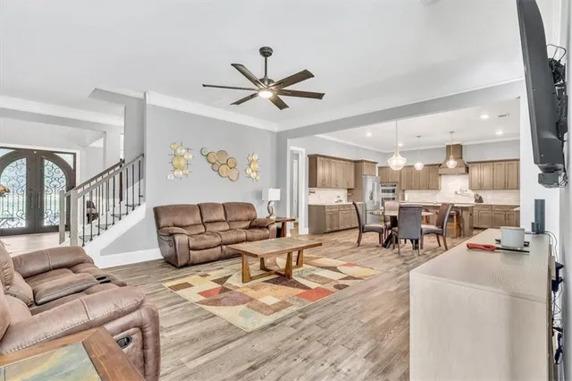 a large kitchen with a table and chairs