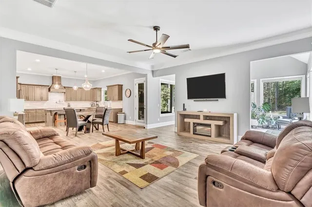 a large kitchen with a table and chairs