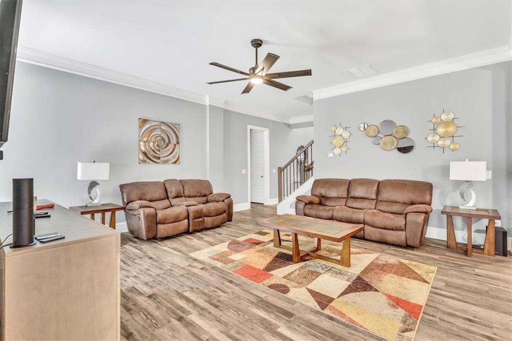 590 Eskew Road McDonough, GA 30252 - Photo 14 of 59 a living room with furniture and a wooden floor