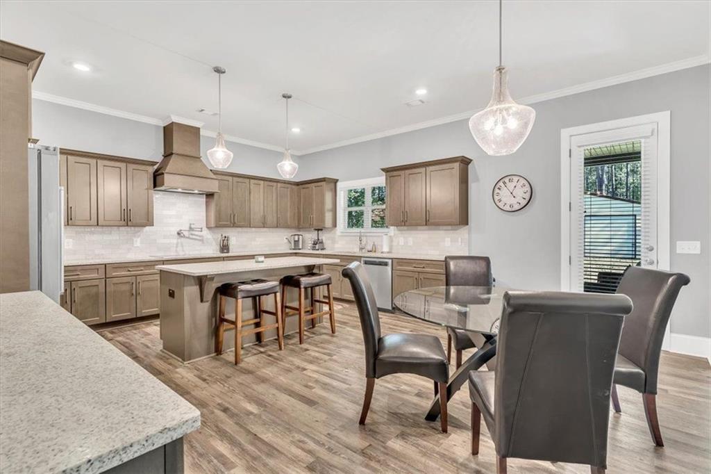 590 Eskew Road McDonough, GA 30252 - Photo 16 of 59 a large kitchen with a table and chairs