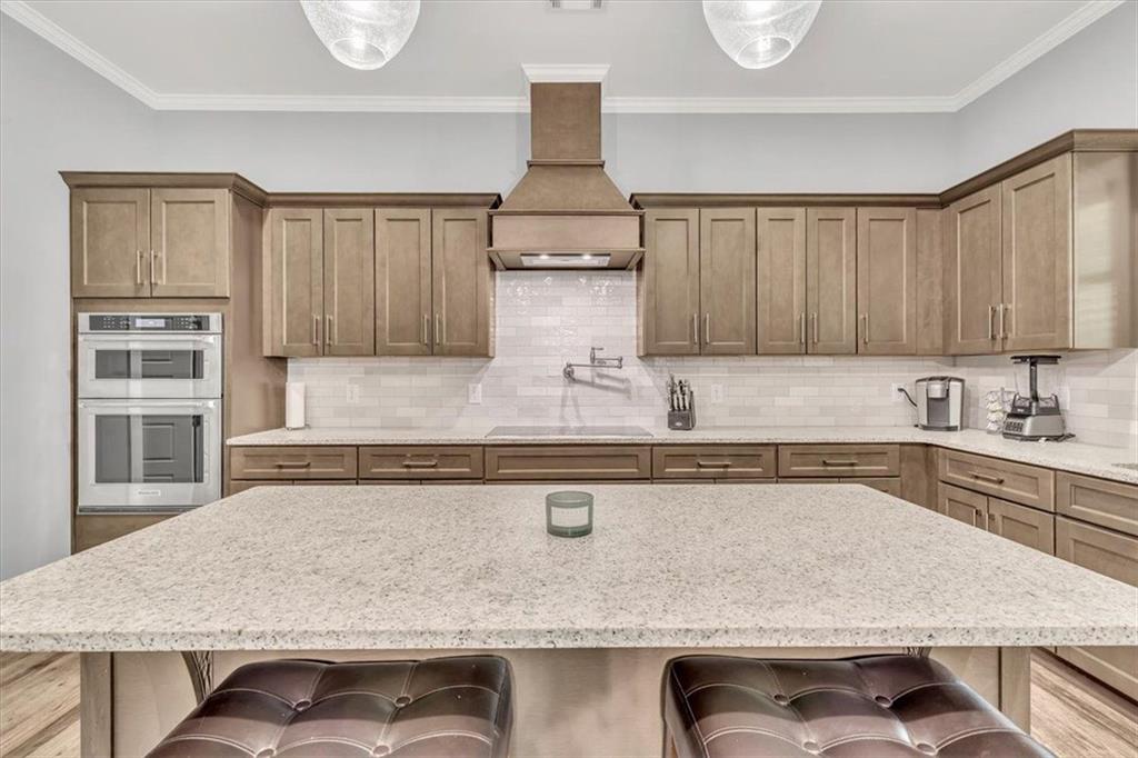 590 Eskew Road McDonough, GA 30252 - Photo 18 of 59 a kitchen with stainless steel appliances granite countertop a sink dishwasher stove and cabinets