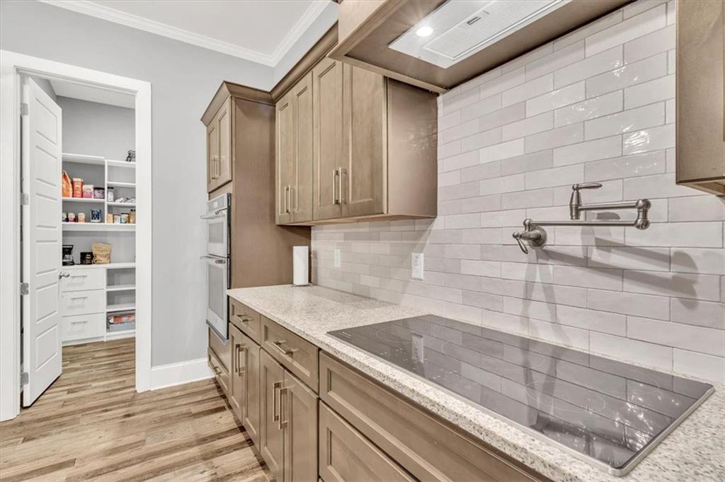 590 Eskew Road McDonough, GA 30252 - Photo 19 of 59 a kitchen with a sink and cabinets