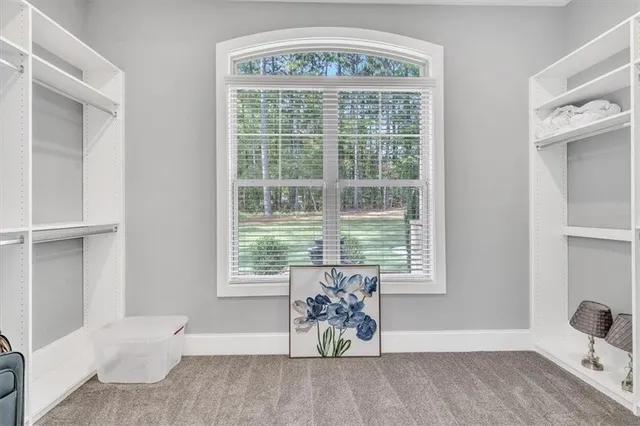 a bath tub sitting next to a bathroom sink