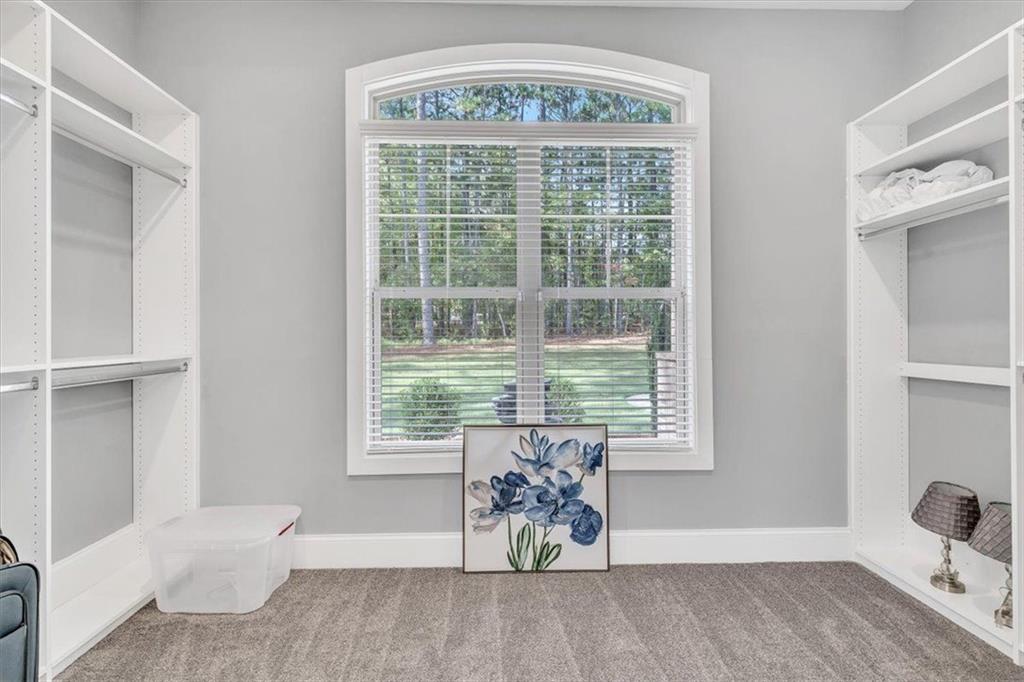 590 Eskew Road McDonough, GA 30252 - Photo 29 of 59 a view of an empty room with a window
